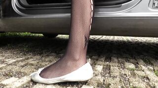 2023-08-06-super-hot-petra-revving-a-car-engine-in-black-fishnet-stockings