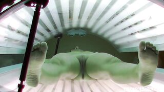 brunette-enjoys-her-solarium-session-flashes-her-pussy